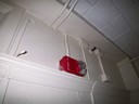 The world is actually colorless; the fire alarm is the only source of color.